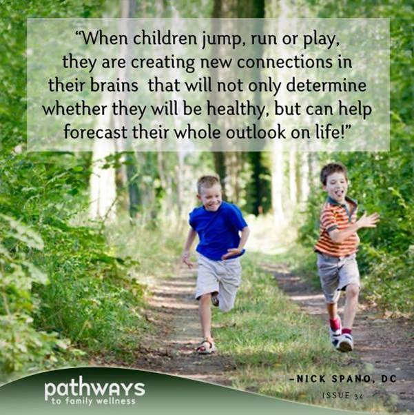 "children running wooded path"